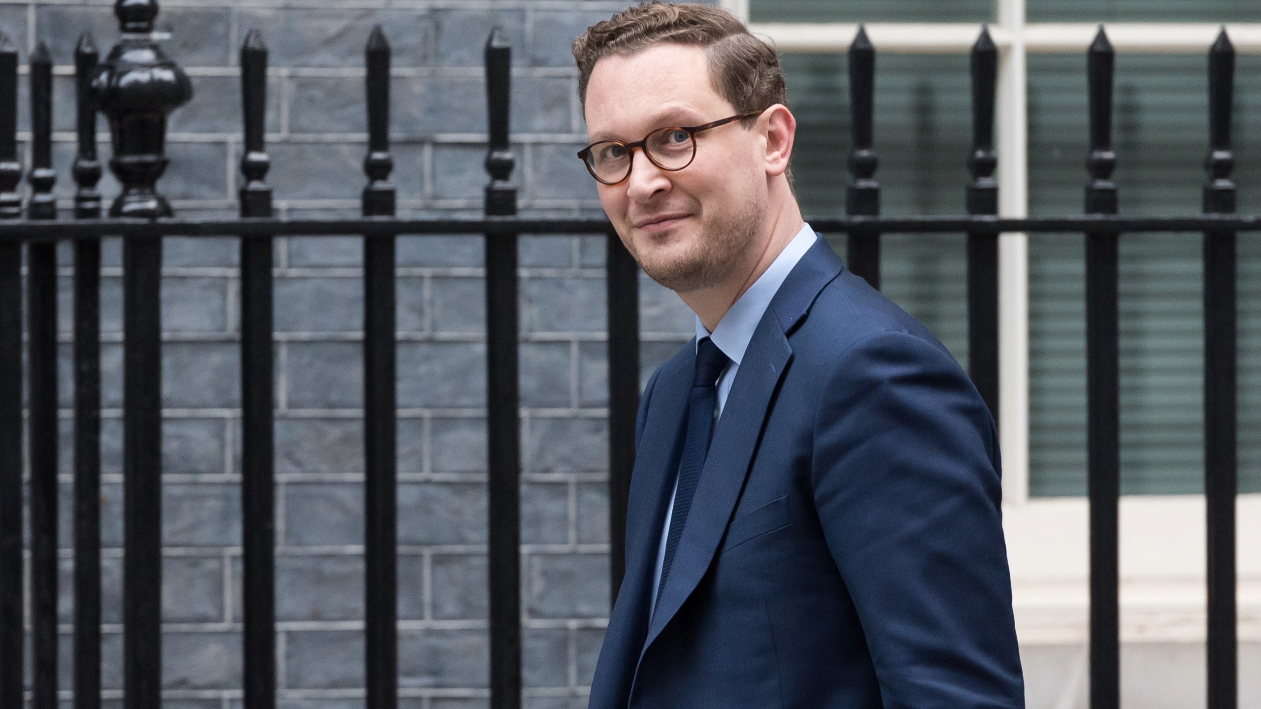 Darren Jones, chief secretary to the prime minister, walking past black railings on his way to Number 10 Downing Street.
