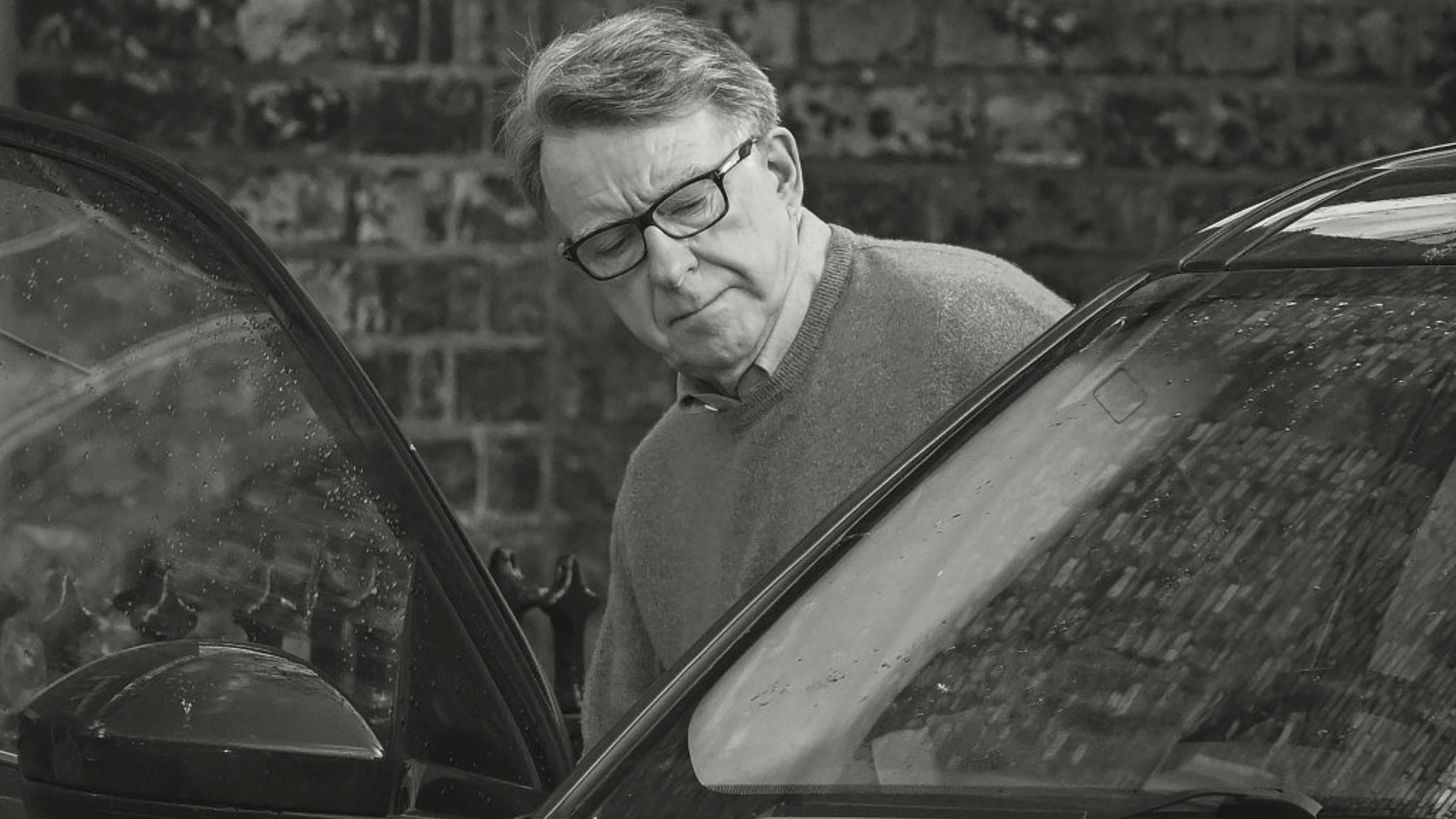 Peter Mandelson getting into a car